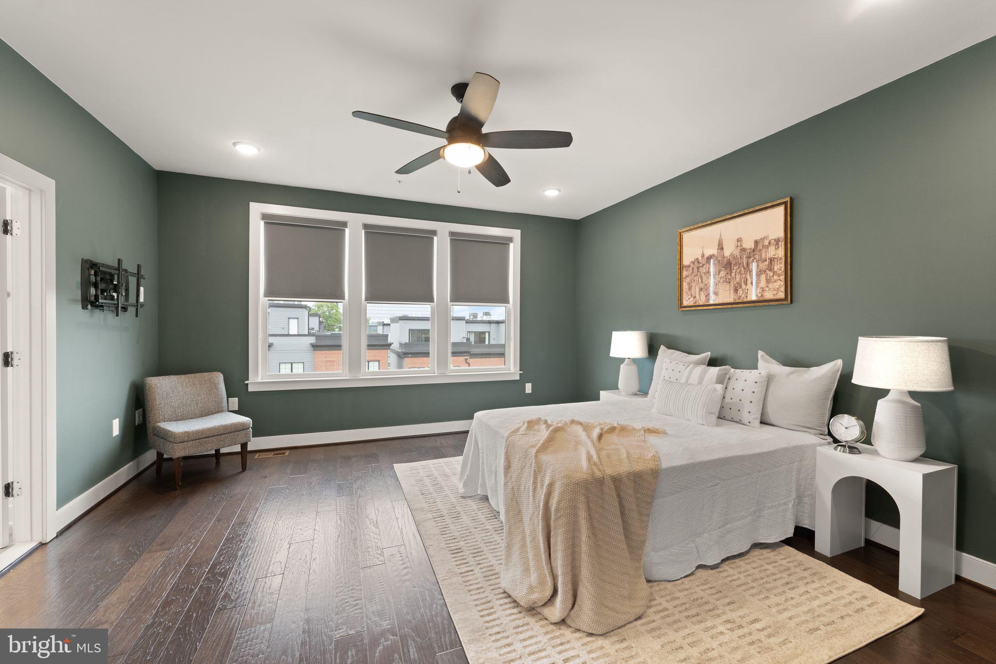 1867 Michael Faraday Drive, Unit 4 Reston, VA 20190 - Photo 29 of 53 a bedroom with a bed and a window