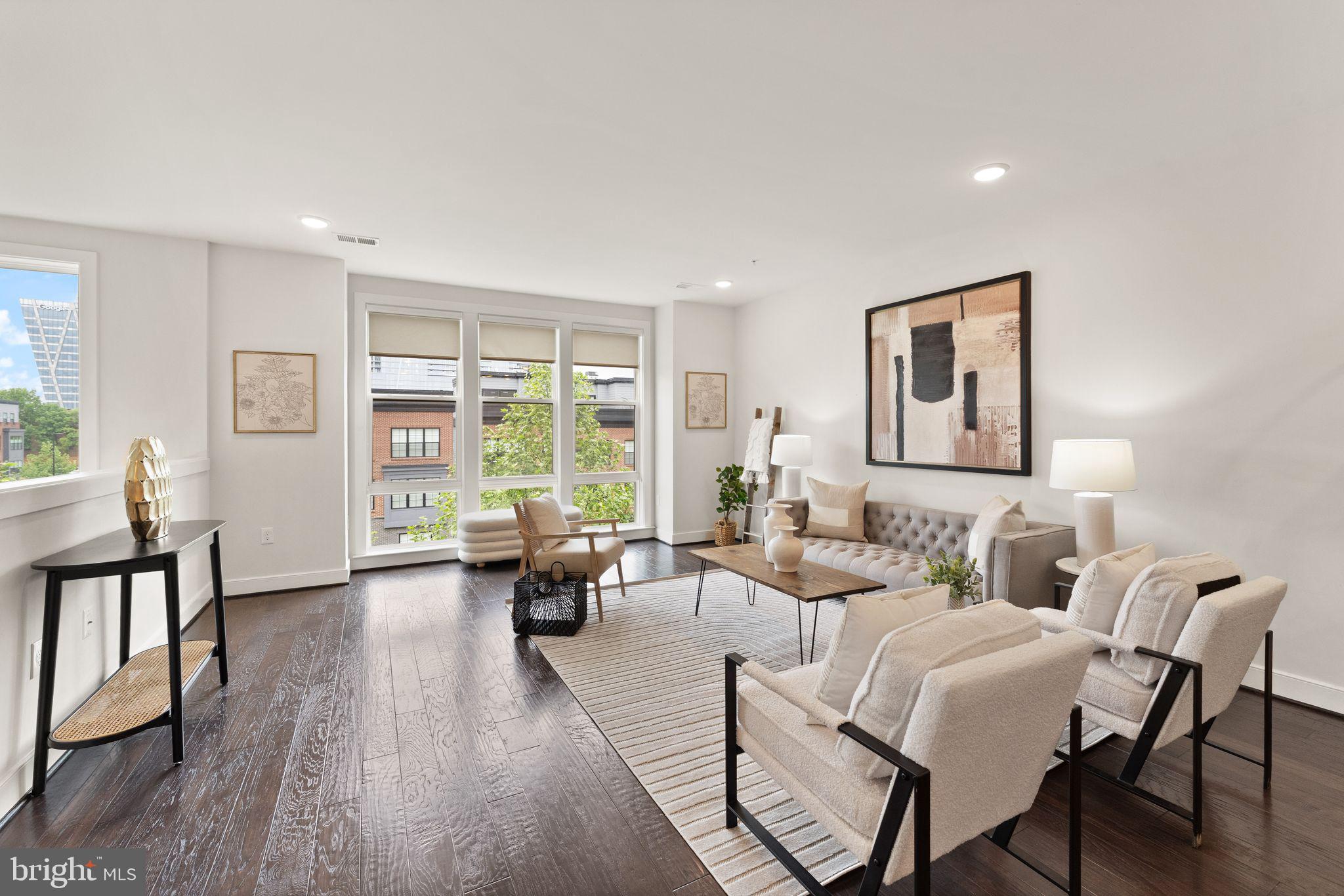 1867 Michael Faraday Drive, Unit 4 Reston, VA 20190 - Photo 6 of 53 a living room with furniture and wooden floor