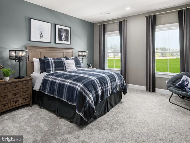 a bedroom with bed and a window