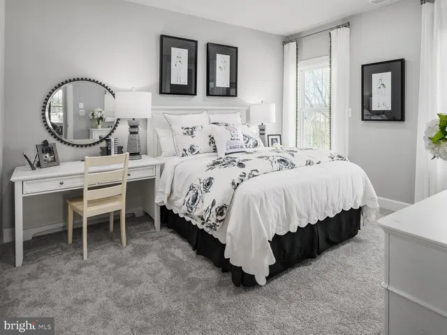 a view of storage and utility room with washer and dryer