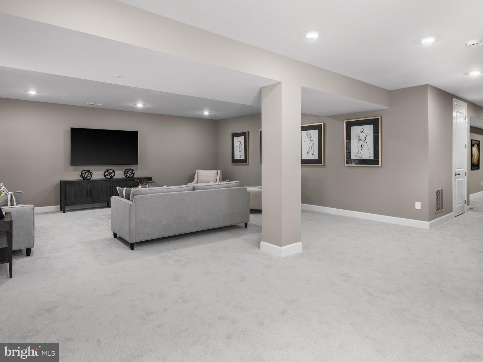 1221 Bear Branch Road Laurel, MD 20708 - Photo 21 of 22 a living room with furniture and a flat screen tv