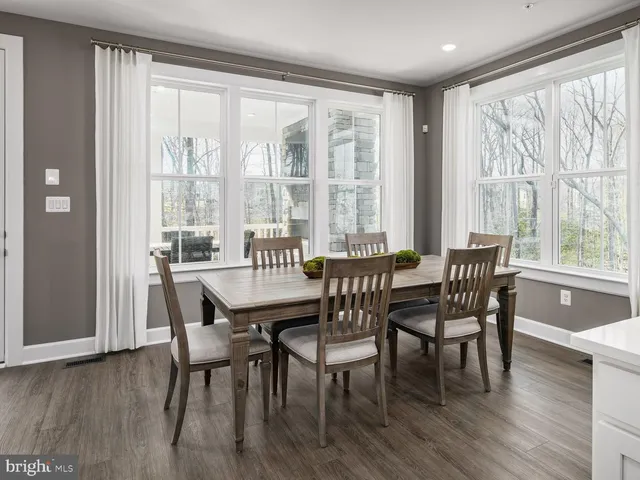 a dining room with furniture window wooden floor