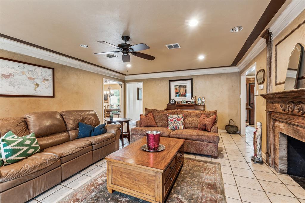 5109 Dewdrop Lane Fort Worth, TX 76123 - Photo 17 of 40 a living room with furniture and a fireplace