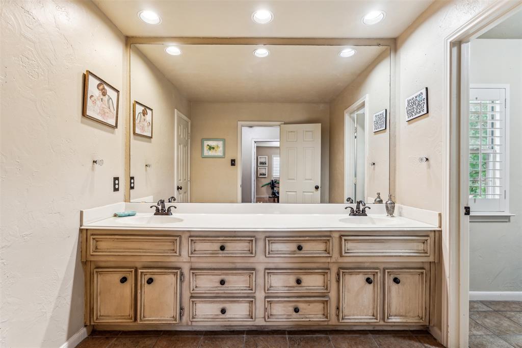 5109 Dewdrop Lane Fort Worth, TX 76123 - Photo 27 of 40 a bathroom with a sink double vanity and a mirror
