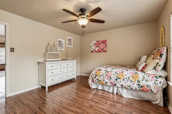 a bedroom with a bed and a dresser