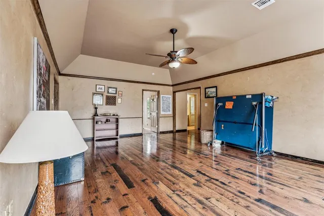 a view of a livingroom with furniture wooden floor and window