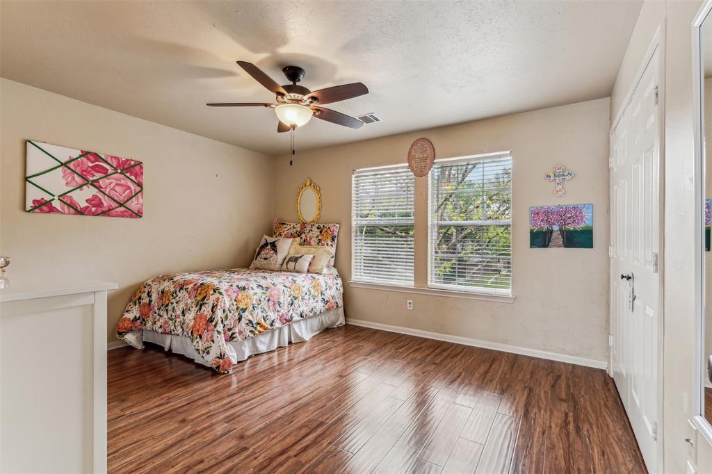 5109 Dewdrop Lane Fort Worth, TX 76123 - Photo 33 of 40 a bedroom with a bed and a window