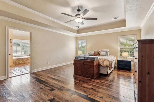 a bed room with bed and window