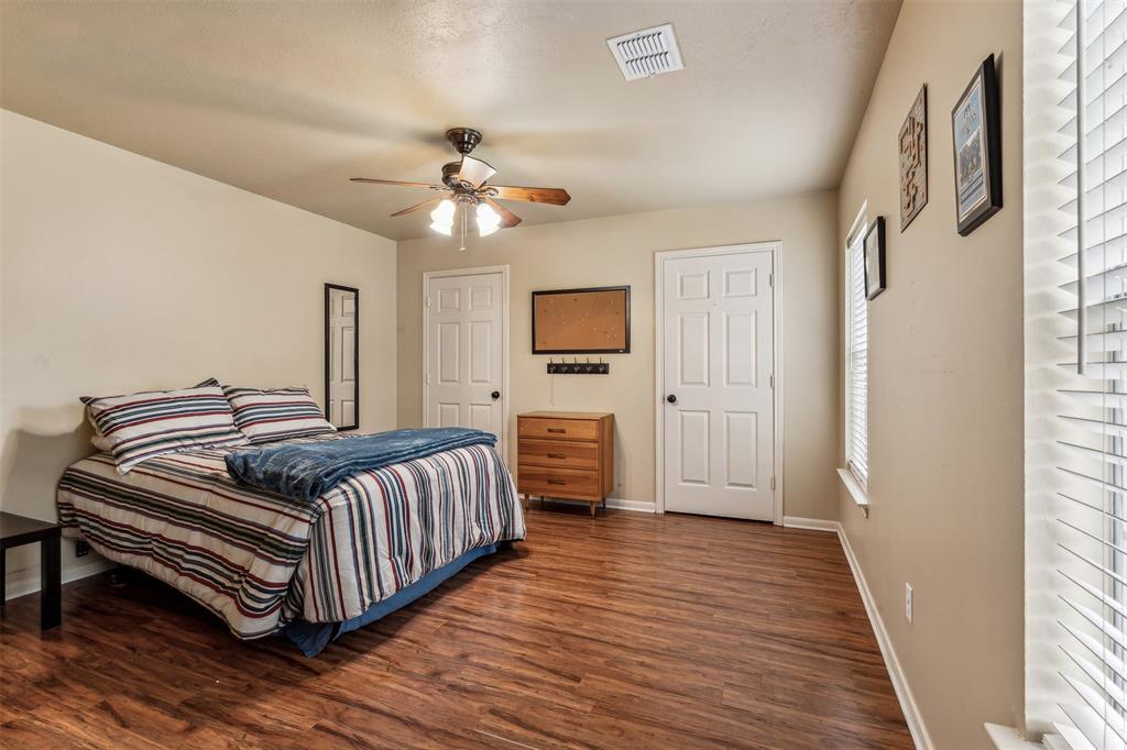 5109 Dewdrop Lane Fort Worth, TX 76123 - Photo 35 of 40 a bedroom with furniture and wooden floor