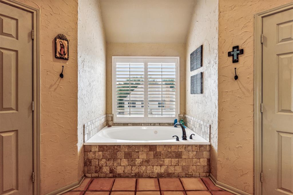 5109 Dewdrop Lane Fort Worth, TX 76123 - Photo 37 of 40 a bathroom with a bathtub and shower
