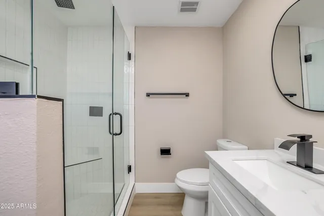 a view of washer and dryer with kitchen in the background