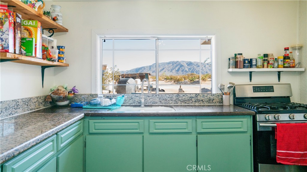 5737 Gammel Road Twentynine Palms, CA 92277 - Photo 13 of 48 a kitchen with sink and cabinets