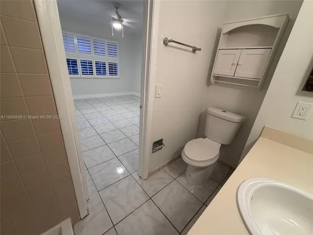 a bathroom with a toilet and a sink