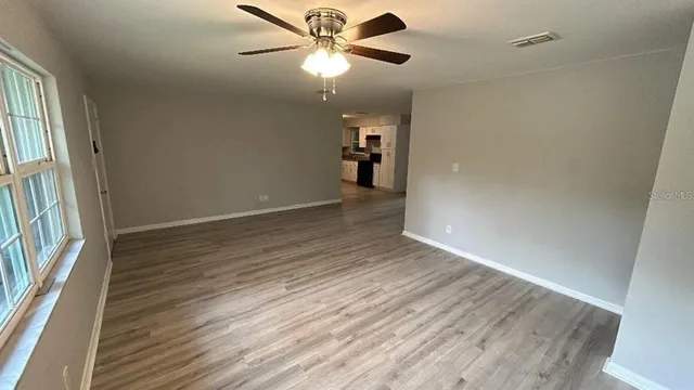 a view of a park with large trees