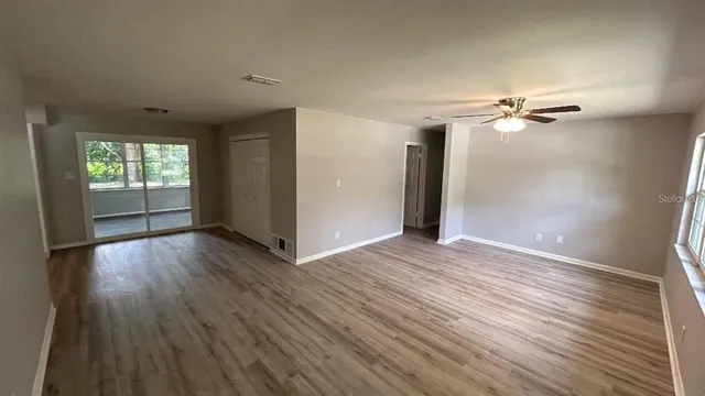 a view of a swimming pool with an outdoor space and seating area