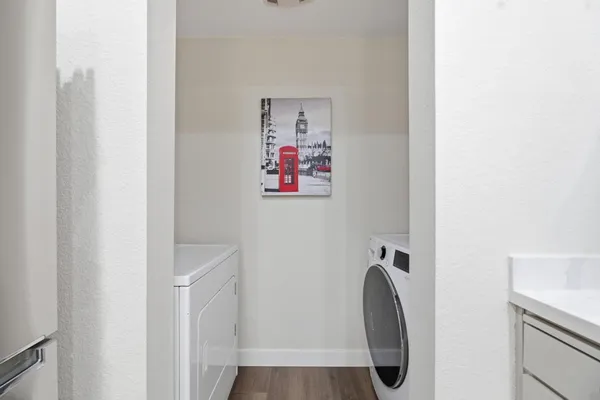 a view of a hallway with washer and dryer