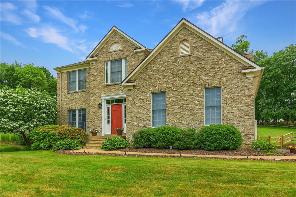 a front view of a house with a yard