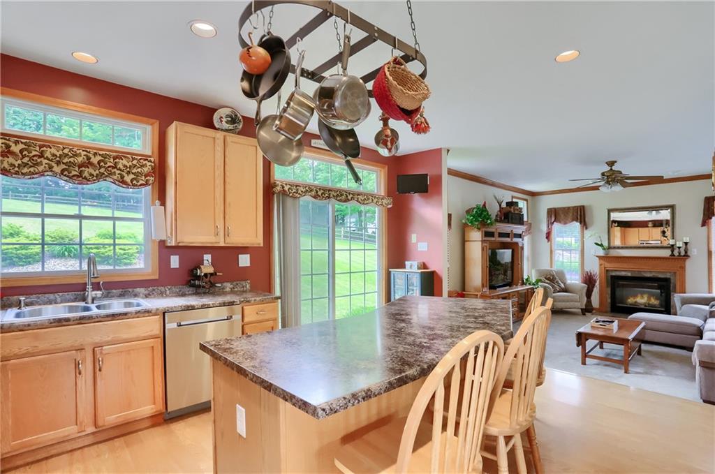 4014 Dickey Road Gibsonia, PA 15044 - Photo 11 of 50 a kitchen with a sink a stove and chairs