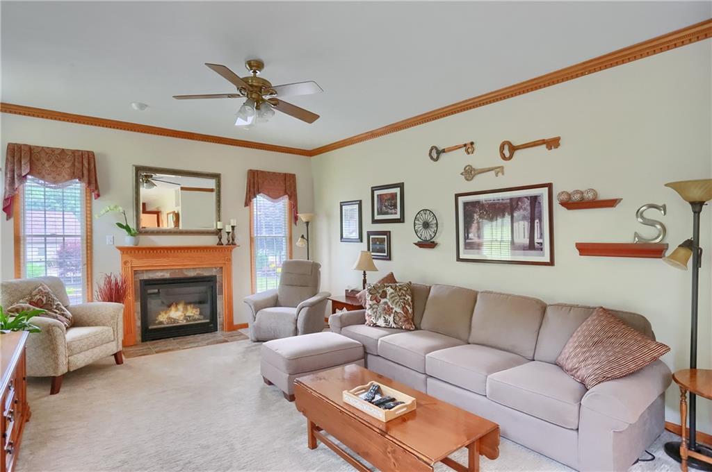4014 Dickey Road Gibsonia, PA 15044 - Photo 17 of 50 a living room with furniture and a fireplace