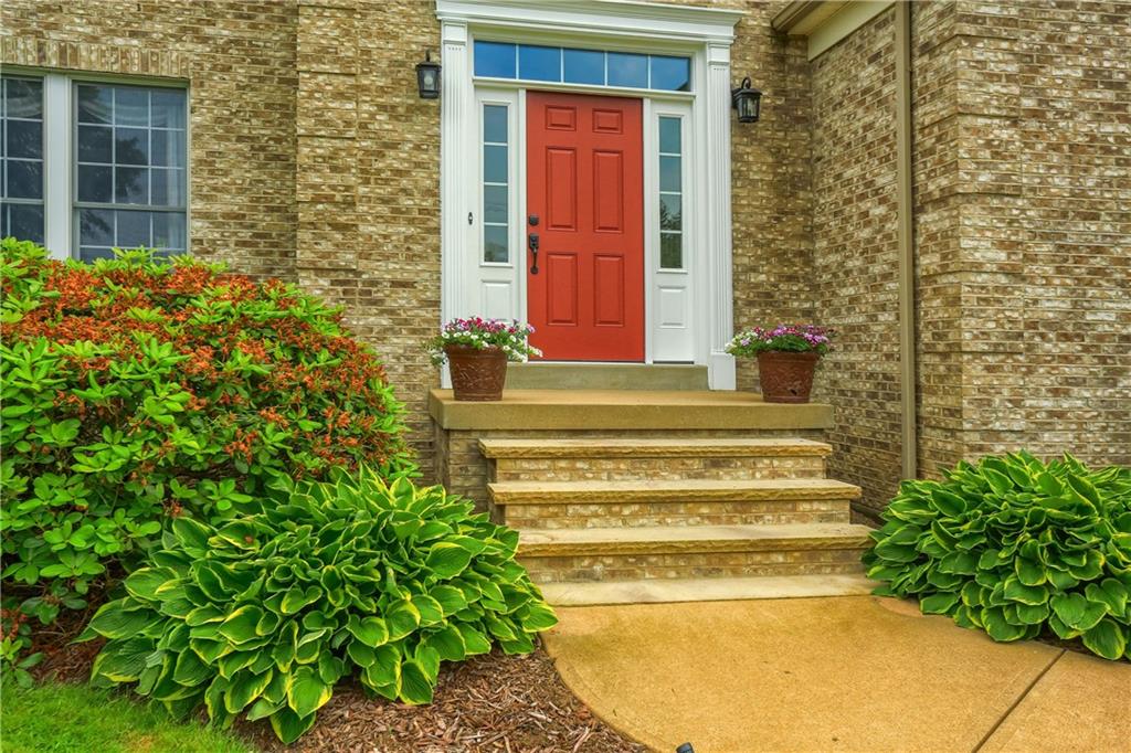 4014 Dickey Road Gibsonia, PA 15044 - Photo 2 of 50 a view of a brick house with a large windows