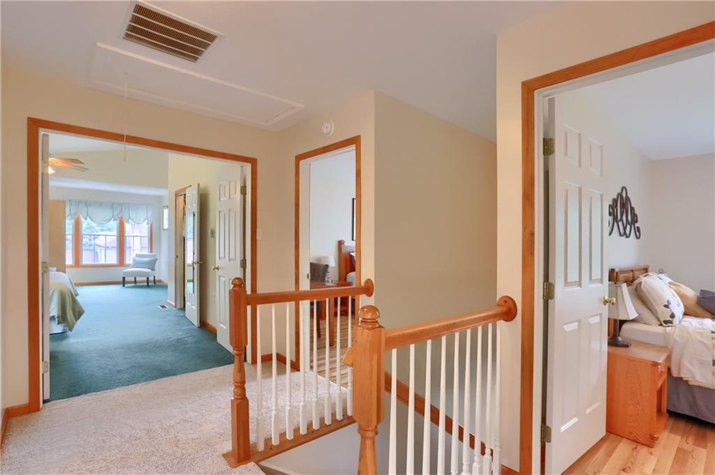 4014 Dickey Road Gibsonia, PA 15044 - Photo 21 of 50 a view of a hallway with wooden floor and stairs