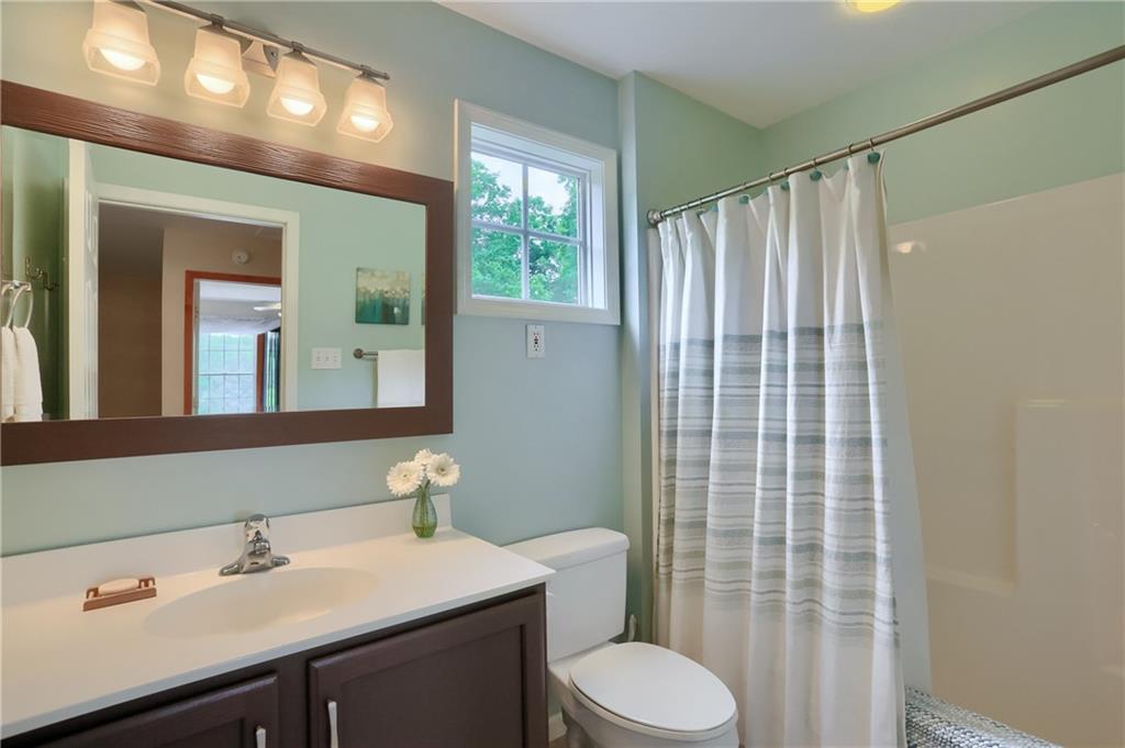 4014 Dickey Road Gibsonia, PA 15044 - Photo 29 of 50 a bathroom with a sink vanity mirror and toilet