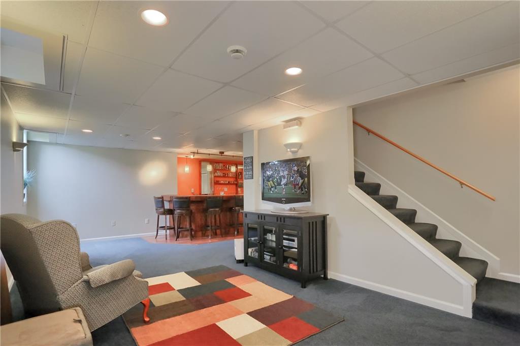 4014 Dickey Road Gibsonia, PA 15044 - Photo 31 of 50 a living room with furniture and a fireplace