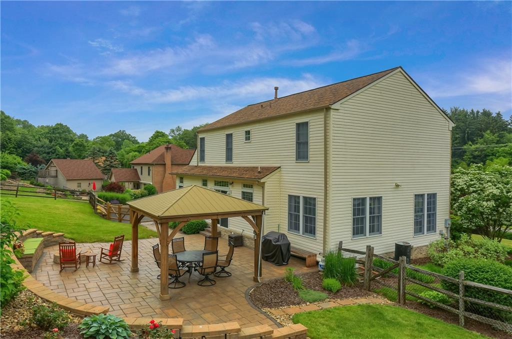 4014 Dickey Road Gibsonia, PA 15044 - Photo 43 of 50 a backyard of a house with table and chairs