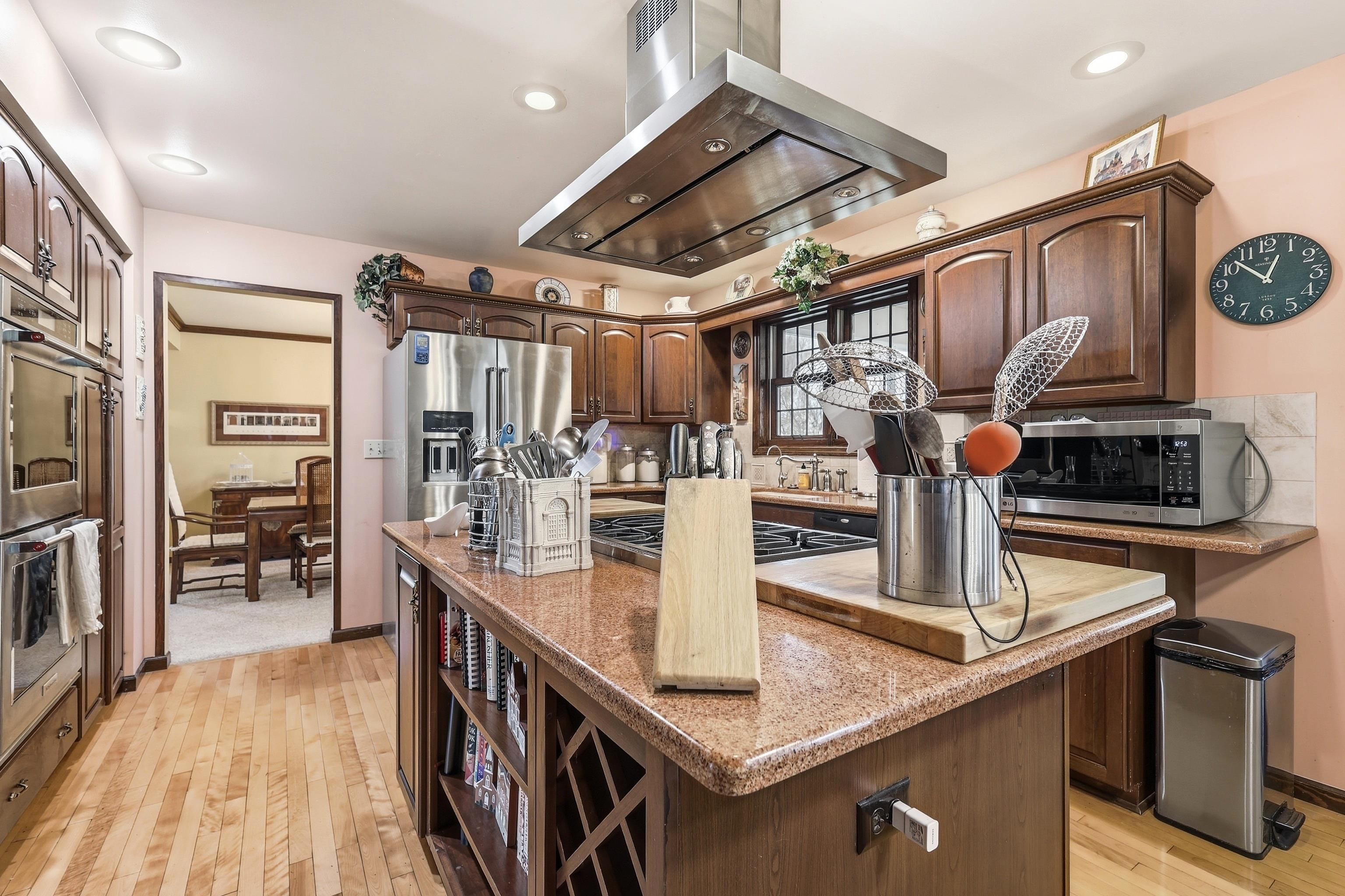 1967 East Cross Road Galena, IL 61036 - Photo 11 of 51 a kitchen with stainless steel appliances granite countertop a sink and stove