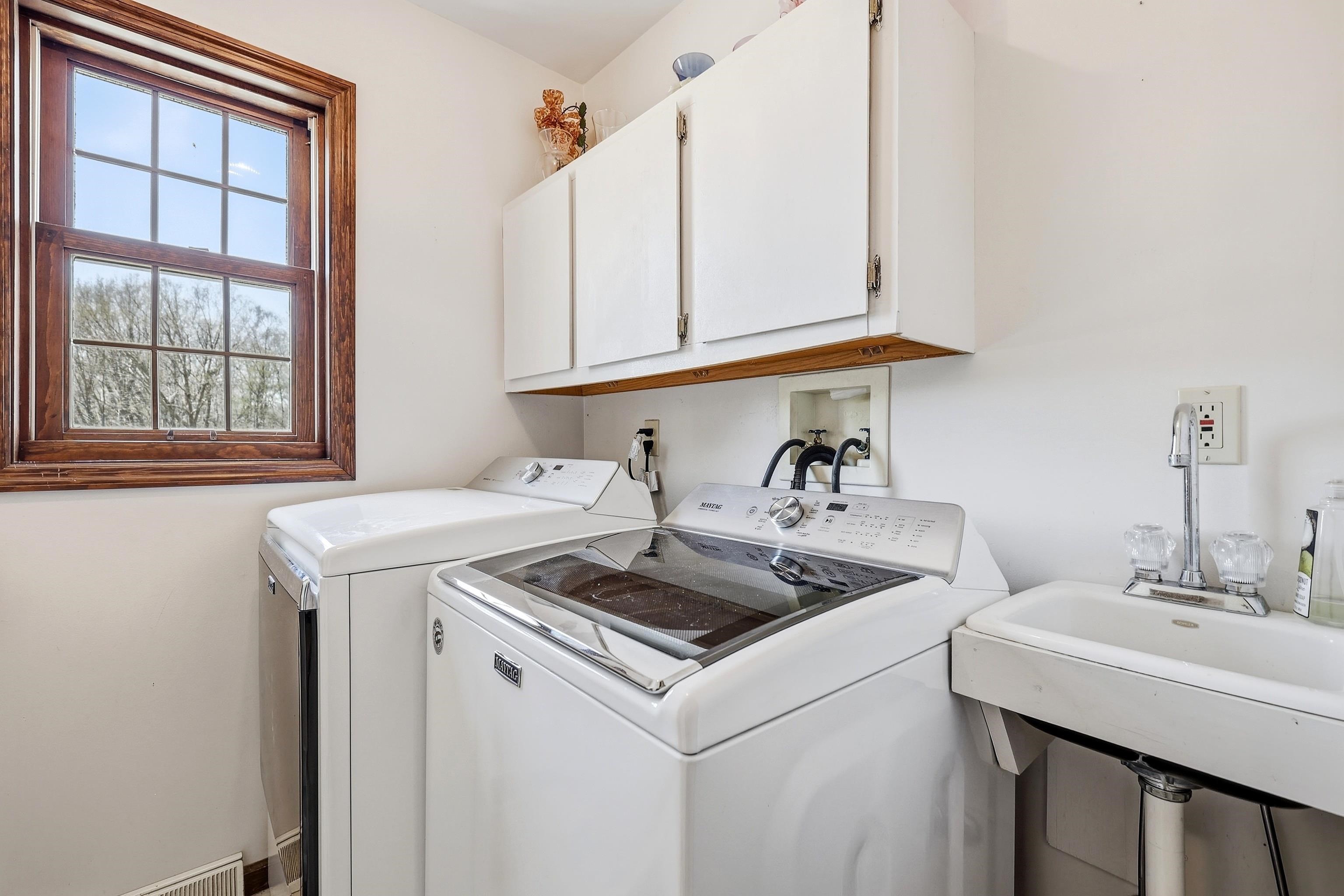1967 East Cross Road Galena, IL 61036 - Photo 22 of 51 a kitchen with a sink stove and cabinets