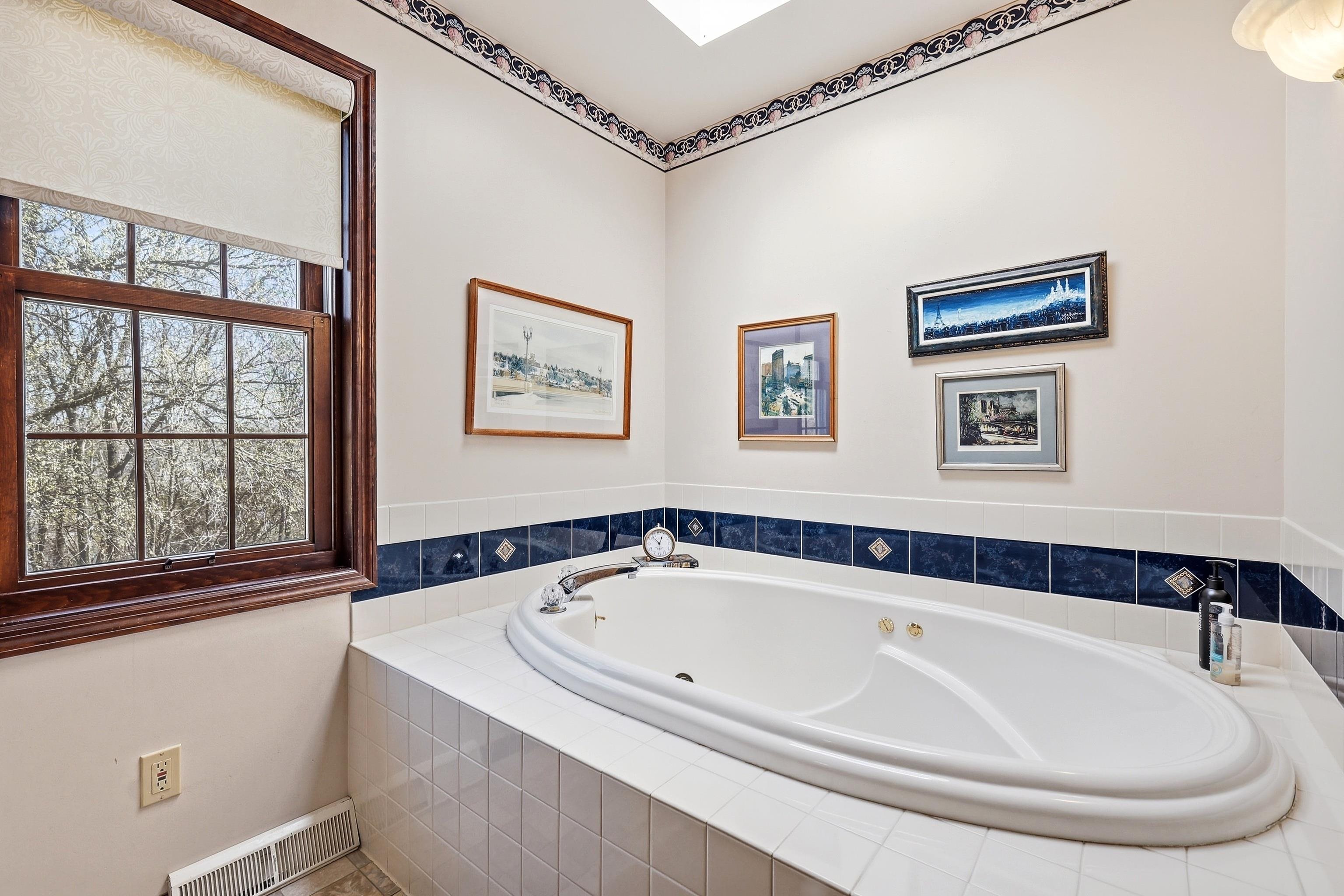 1967 East Cross Road Galena, IL 61036 - Photo 31 of 51 a bathroom with a tub and a window