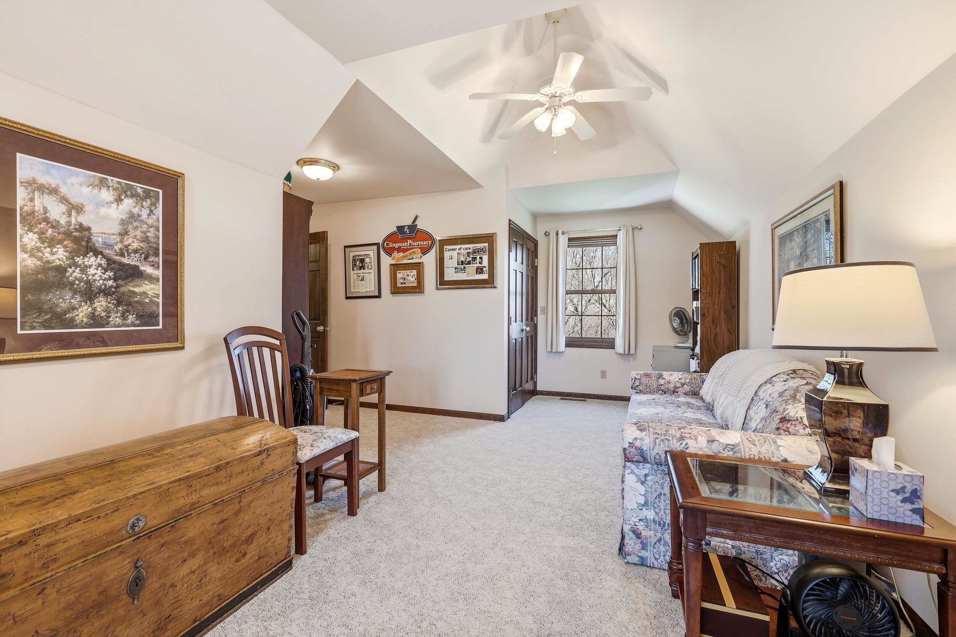 1967 East Cross Road Galena, IL 61036 - Photo 40 of 51 a bedroom with a bed and a chandelier