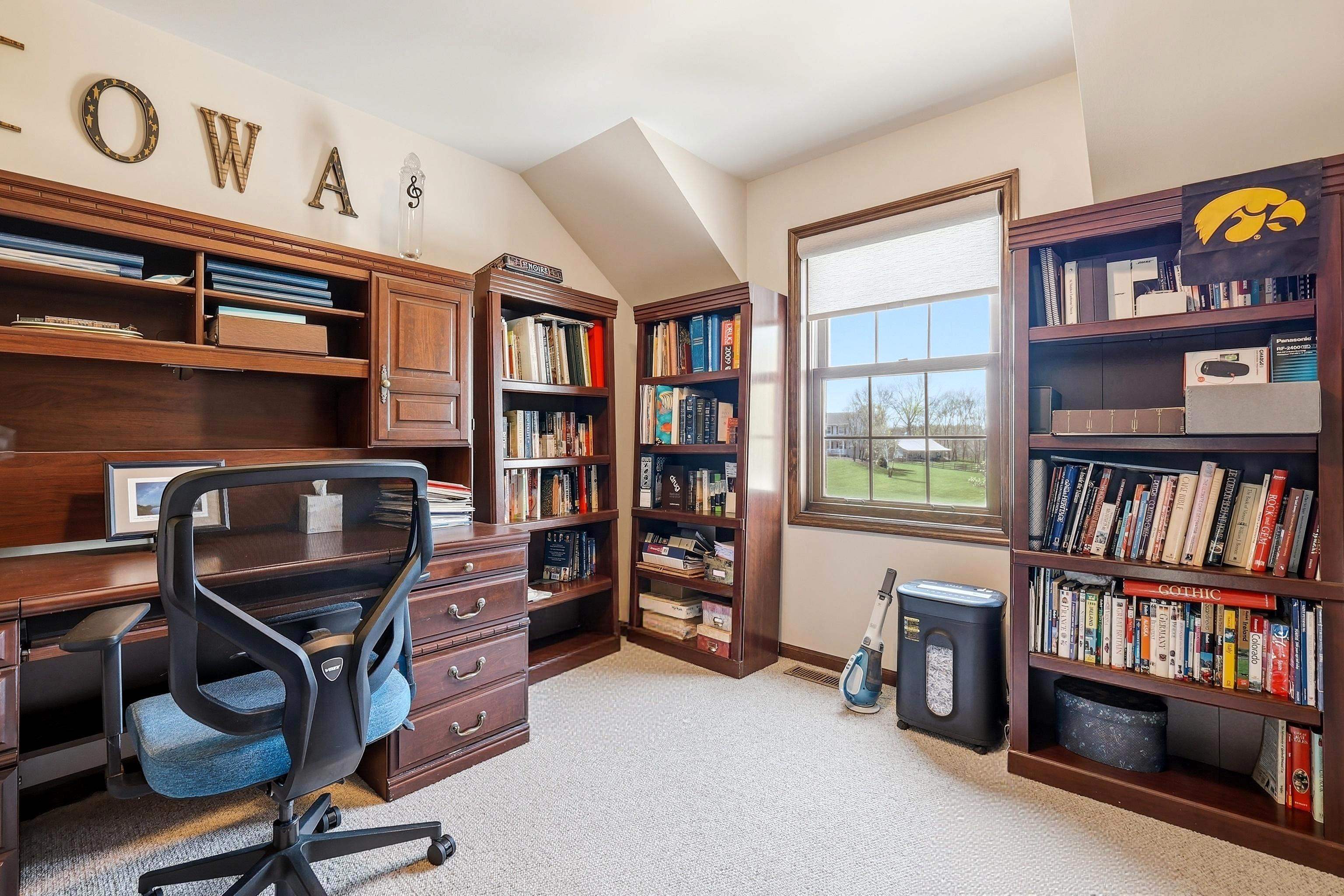1967 East Cross Road Galena, IL 61036 - Photo 42 of 51 a view of a workspace with bookshelf