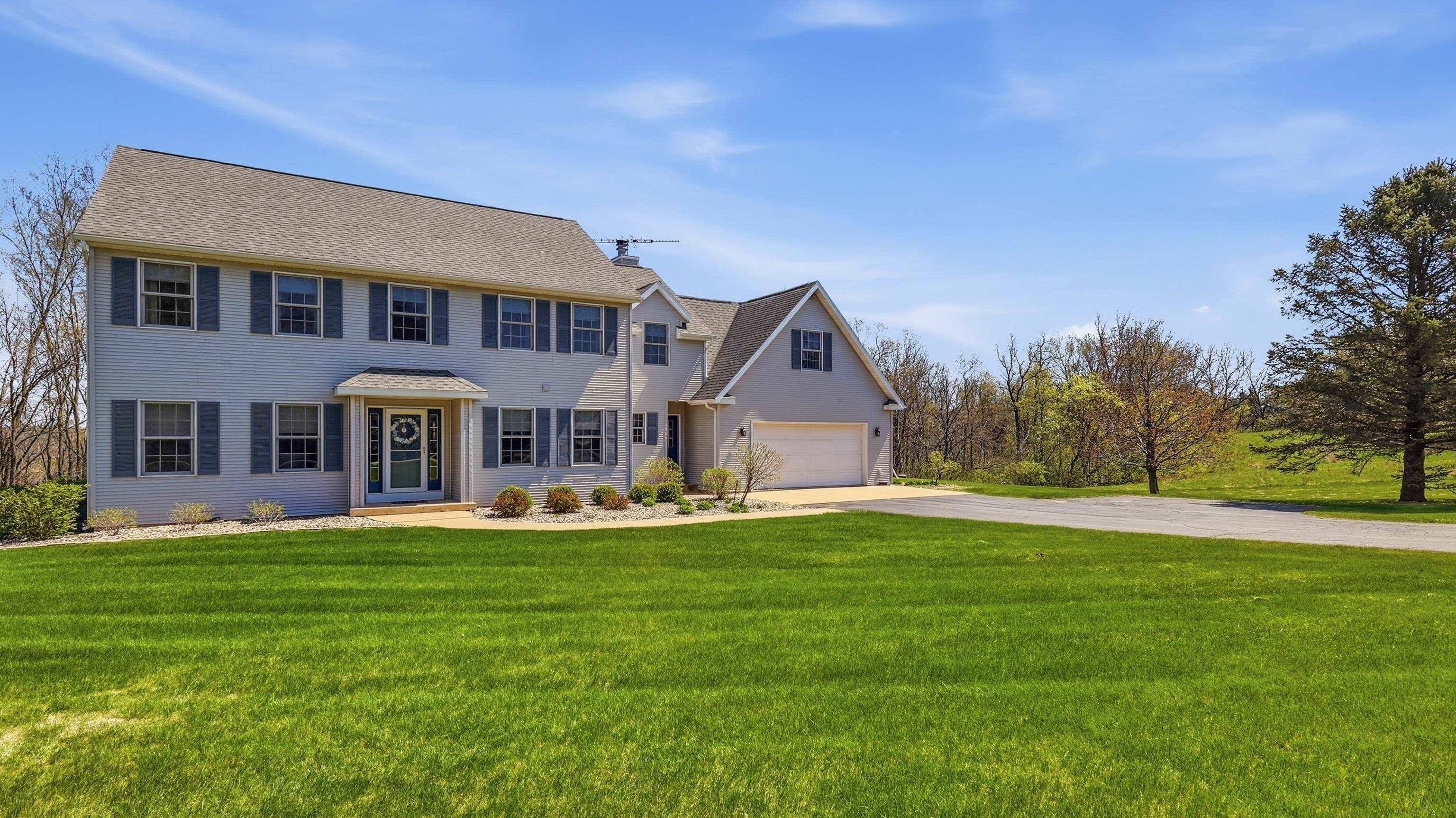 1967 East Cross Road Galena, IL 61036 - Photo 51 of 51 a front view of a house with a garden and trees