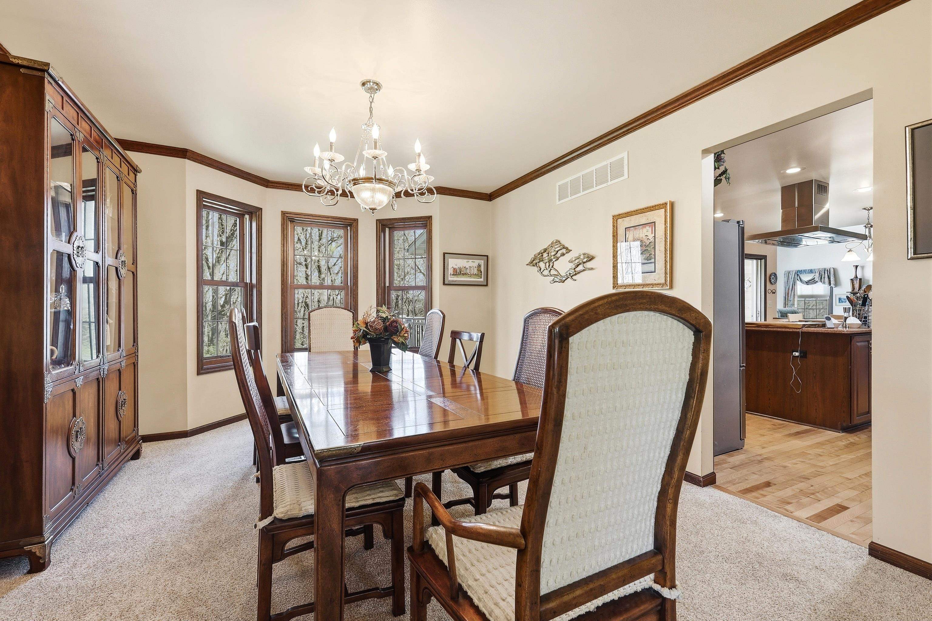 1967 East Cross Road Galena, IL 61036 - Photo 6 of 51 a view of a dining room with furniture and chandelier