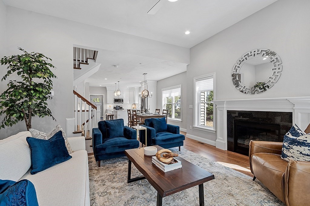 30 Wheeler Hill Road, Unit 61 Berlin, MA 01503 - Photo 13 of 31 a living room with furniture and a fireplace