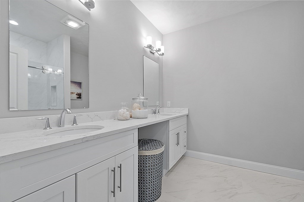 30 Wheeler Hill Road, Unit 61 Berlin, MA 01503 - Photo 15 of 31 a bathroom with a sink double vanity and a mirror
