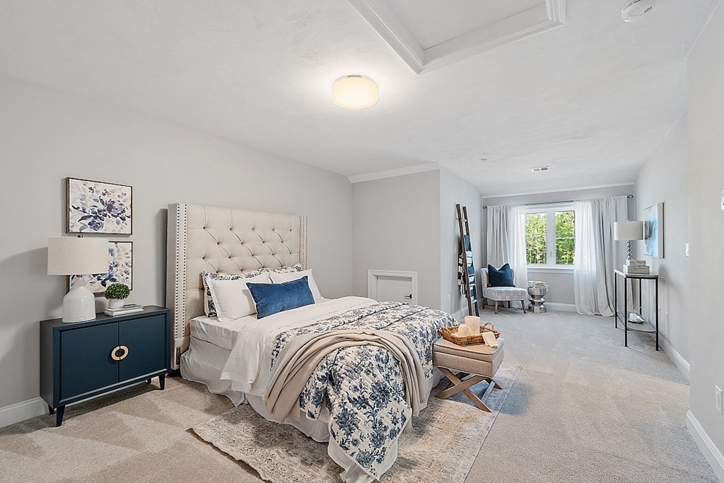 30 Wheeler Hill Road, Unit 61 Berlin, MA 01503 - Photo 20 of 31 a bedroom with a bed and furniture