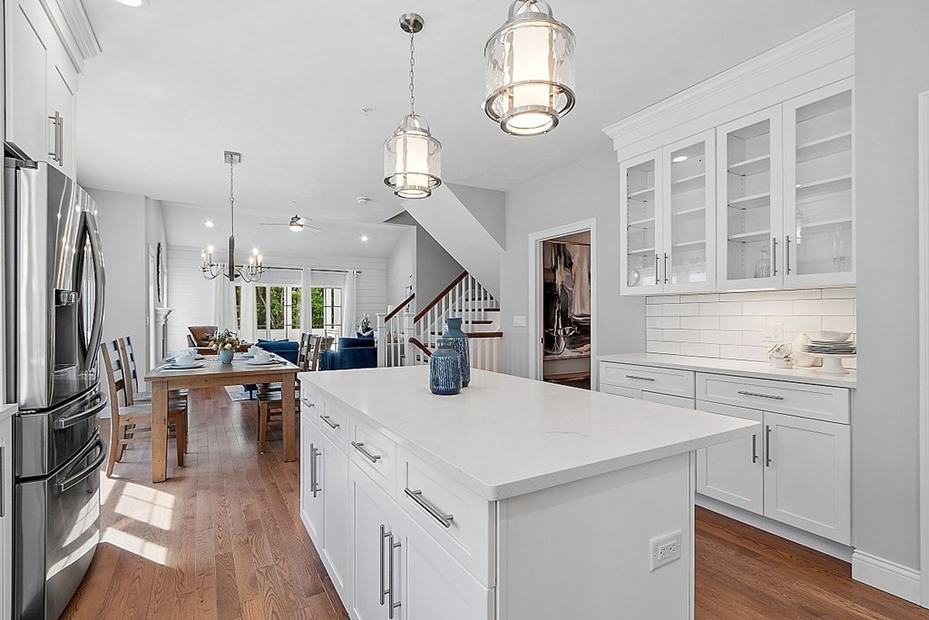 30 Wheeler Hill Road, Unit 61 Berlin, MA 01503 - Photo 2 of 31 a kitchen with sink cabinets and wooden floor
