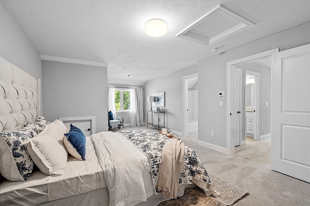 30 Wheeler Hill Road, Unit 61 Berlin, MA 01503 - Photo 21 of 31 a bedroom with a bed and a window