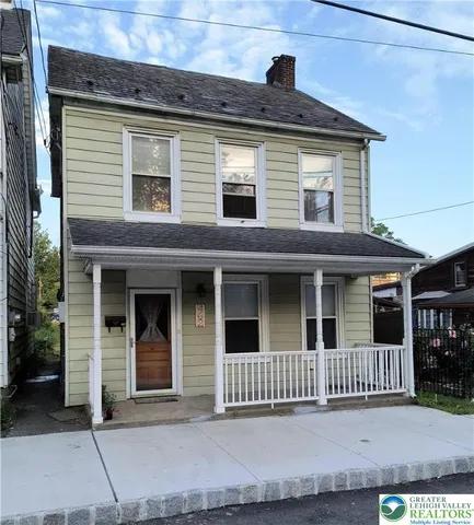 a view of a brick house with a window