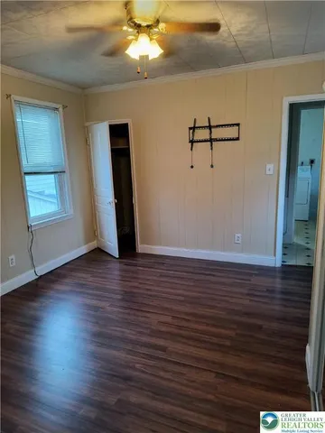 a room with bed and a window