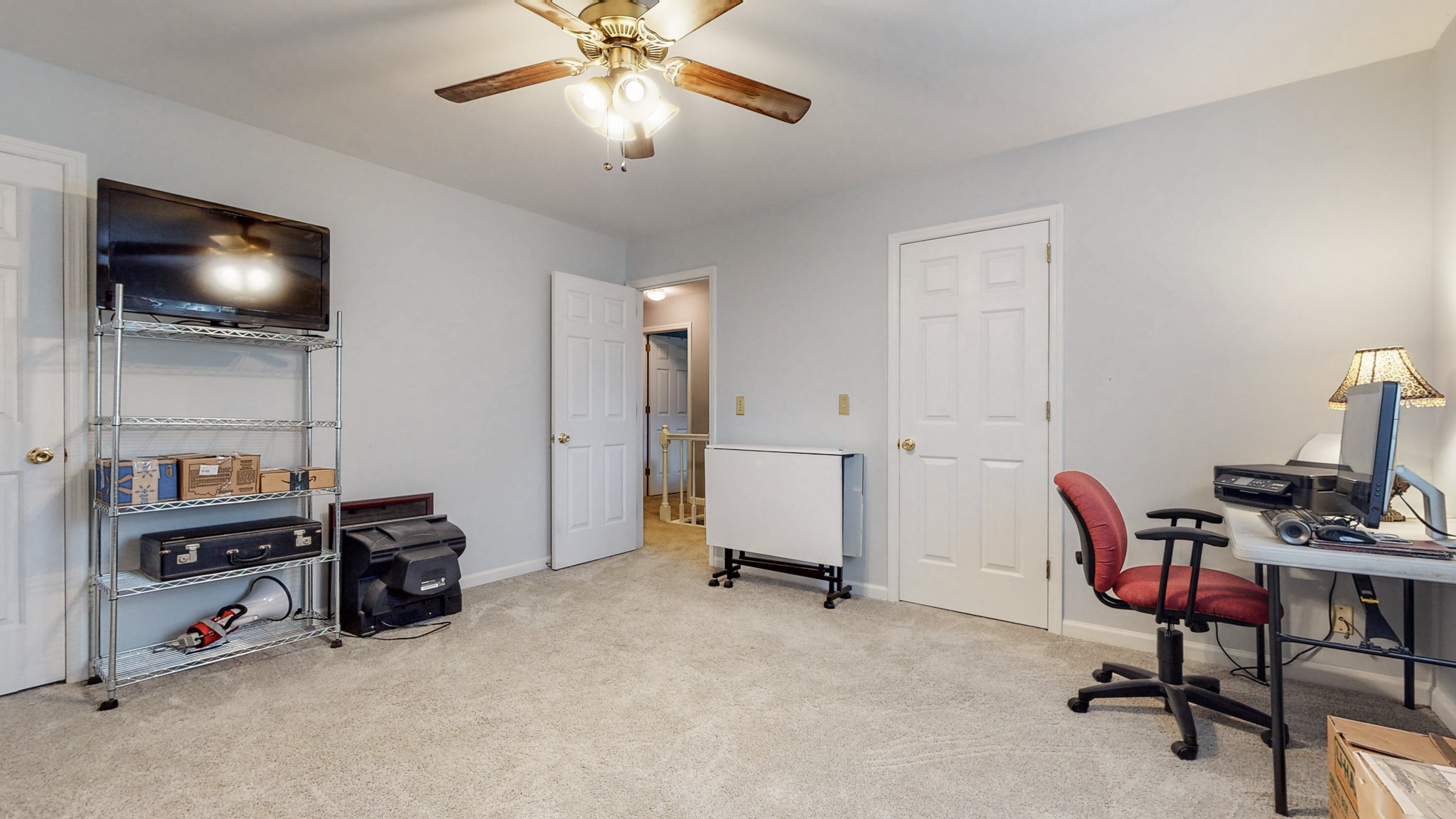 2019 Hidden Cove Road Mount Juliet, TN 37122 - Photo 19 of 29 a view of a workspace with furniture and a ceiling fan