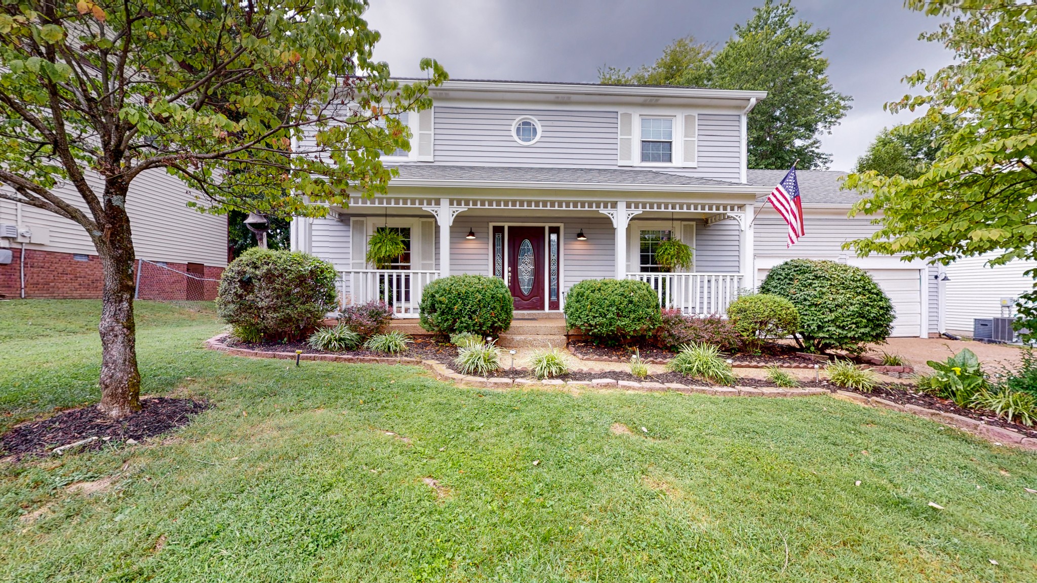 2019 Hidden Cove Road Mount Juliet, TN 37122 - Photo 20 of 29 a front view of a house with a yard and porch