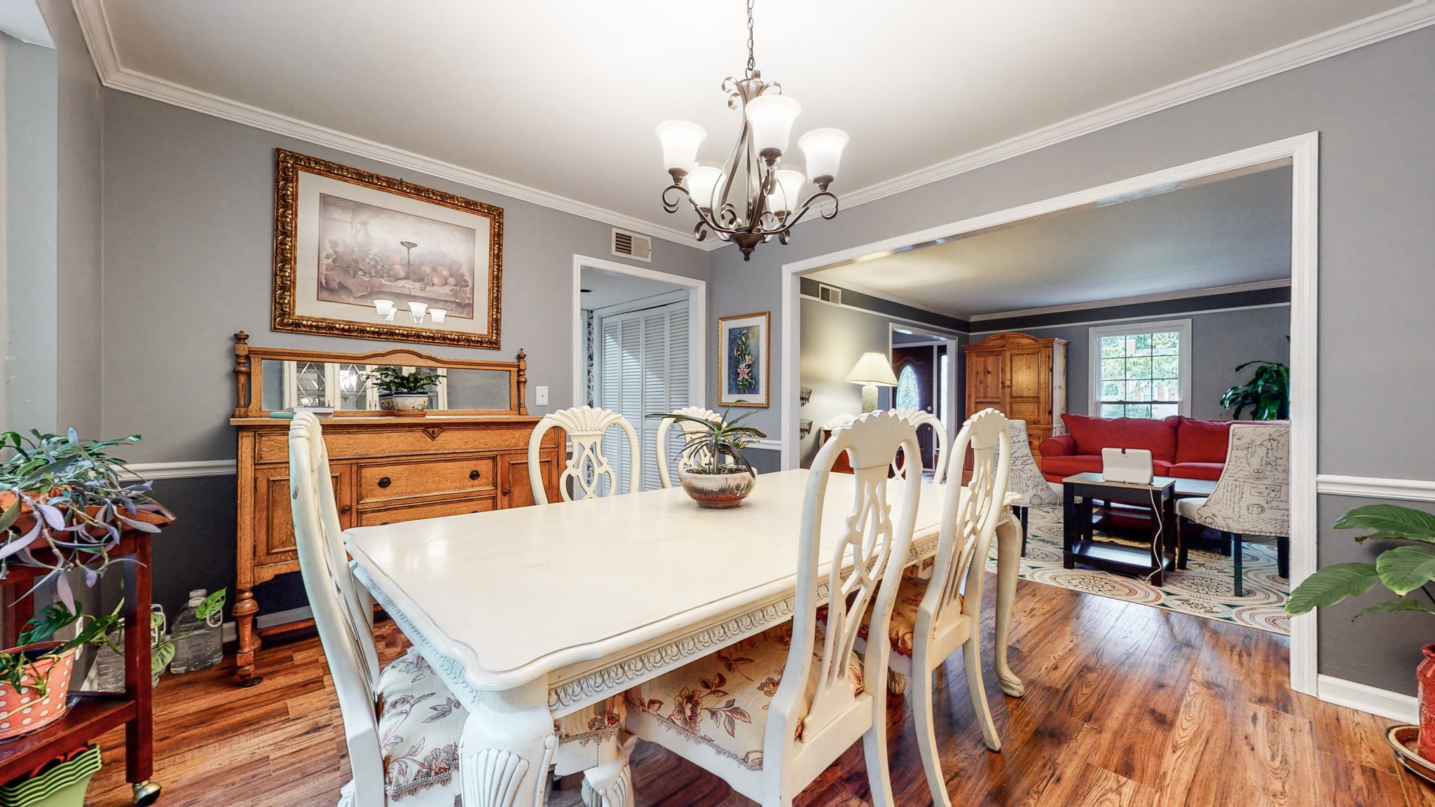2019 Hidden Cove Road Mount Juliet, TN 37122 - Photo 8 of 29 a view of a dining room with furniture a chandelier and wooden floor