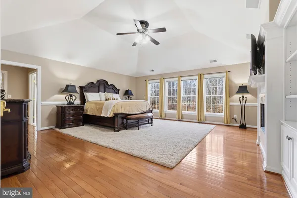 a spacious bathroom with a double vanity sink a mirror and a bathtub