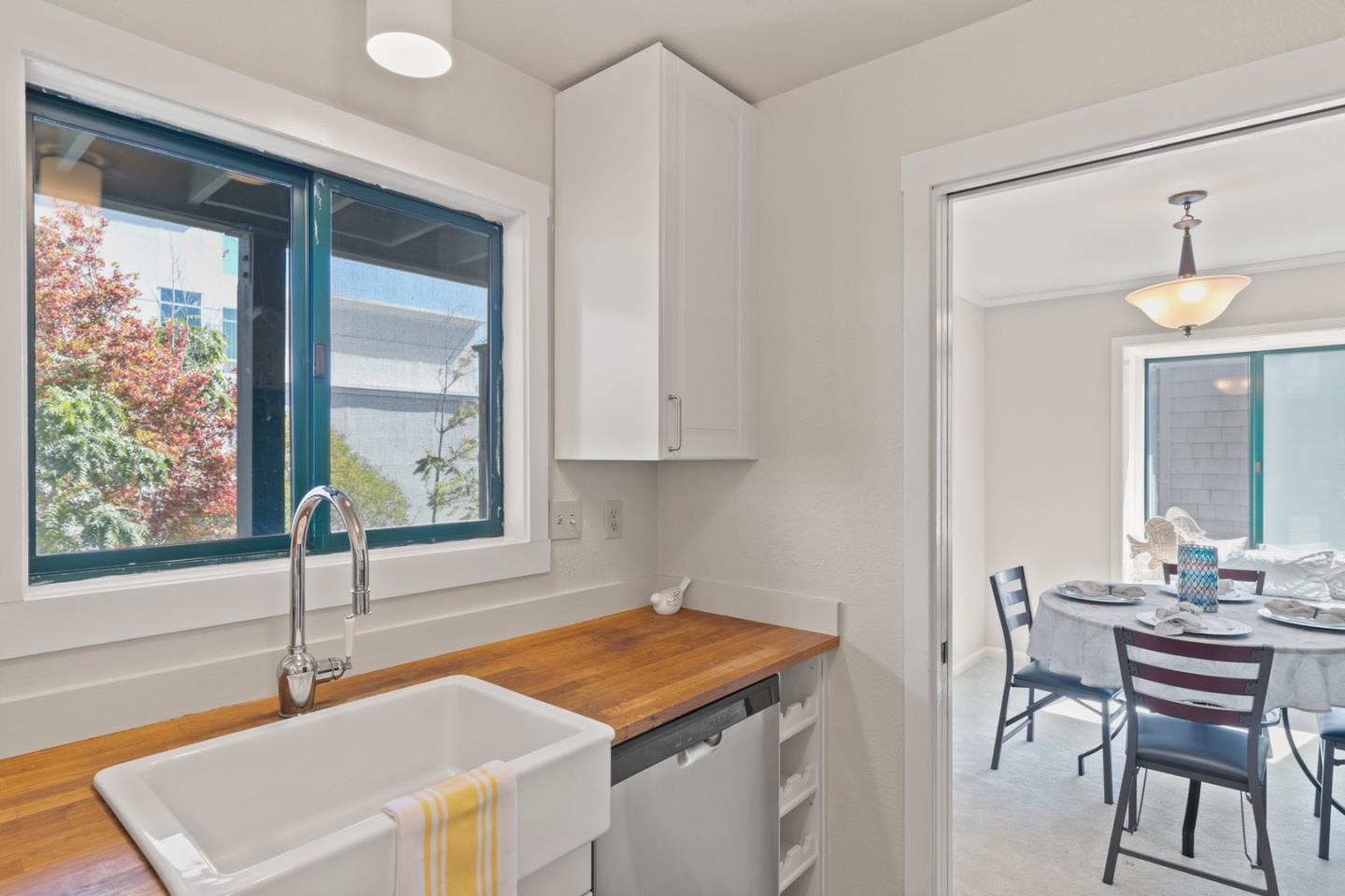 321 Broadway, Unit C2 Santa Cruz, CA 95060 - Photo 11 of 46 a kitchen with stainless steel appliances granite countertop a sink and a cabinets