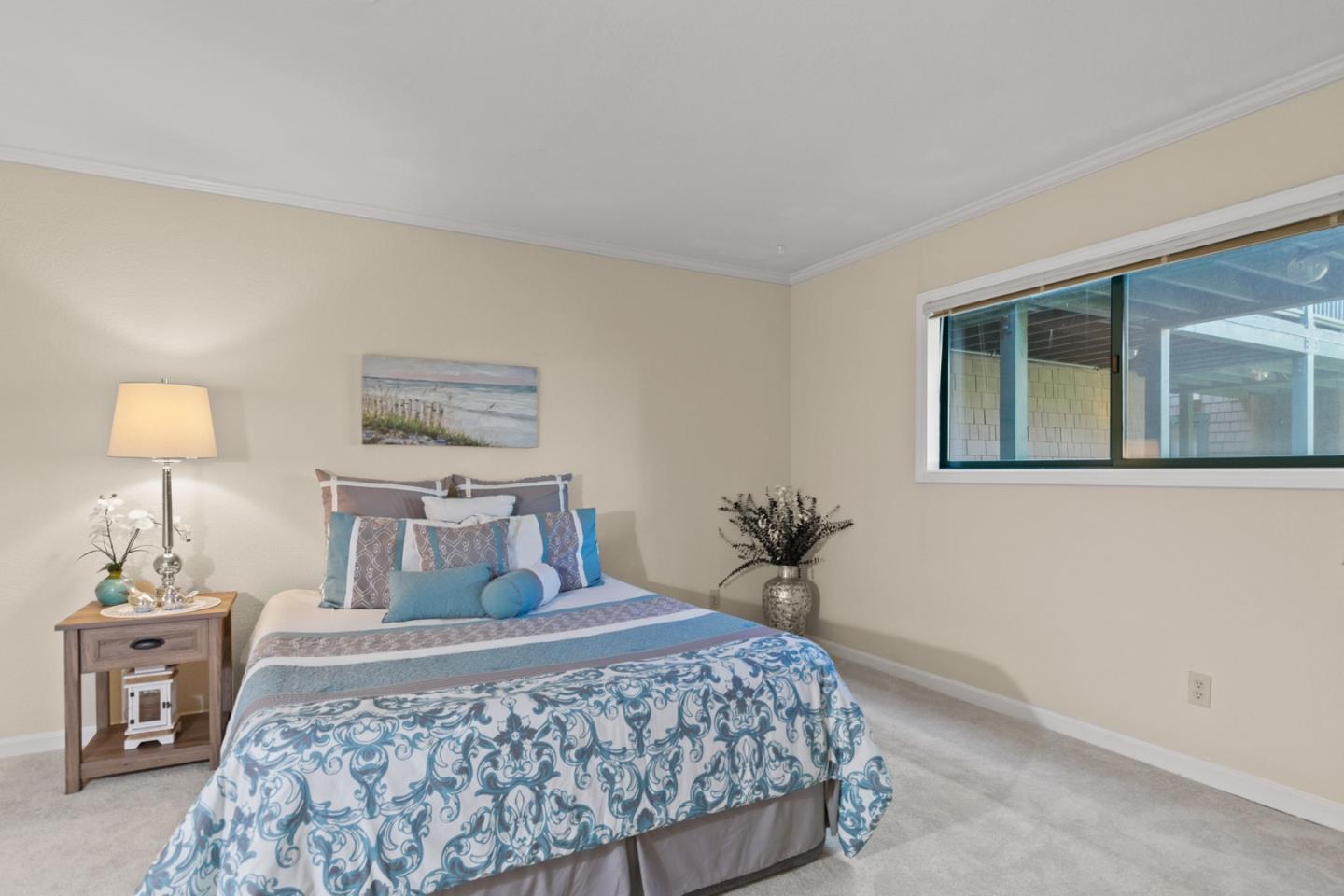 321 Broadway, Unit C2 Santa Cruz, CA 95060 - Photo 13 of 46 a bedroom with a bed and a lamp on table