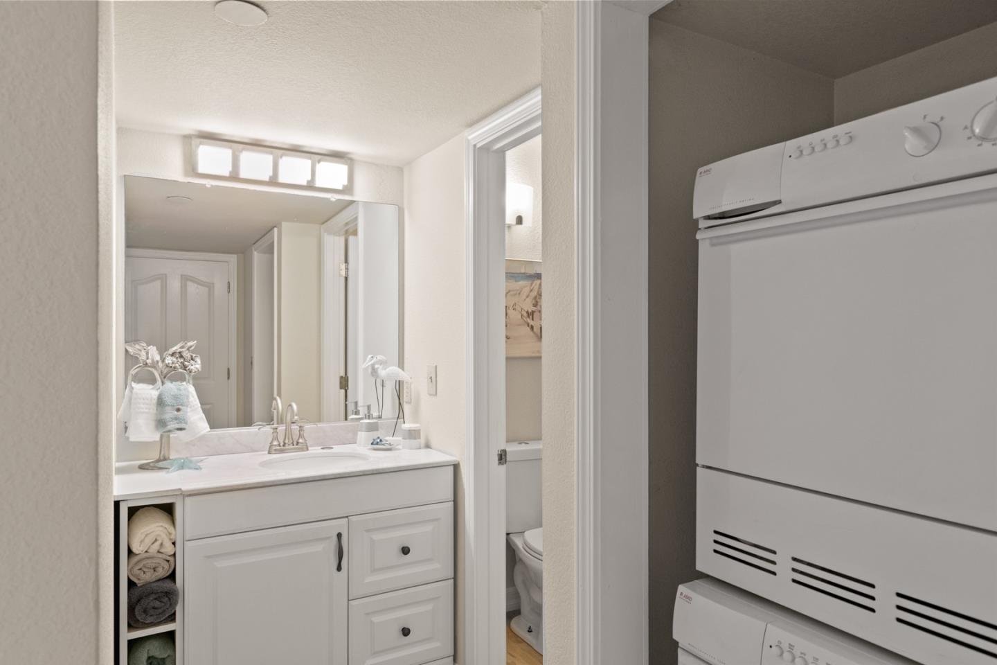 321 Broadway, Unit C2 Santa Cruz, CA 95060 - Photo 16 of 46 a bathroom with a sink and a mirror