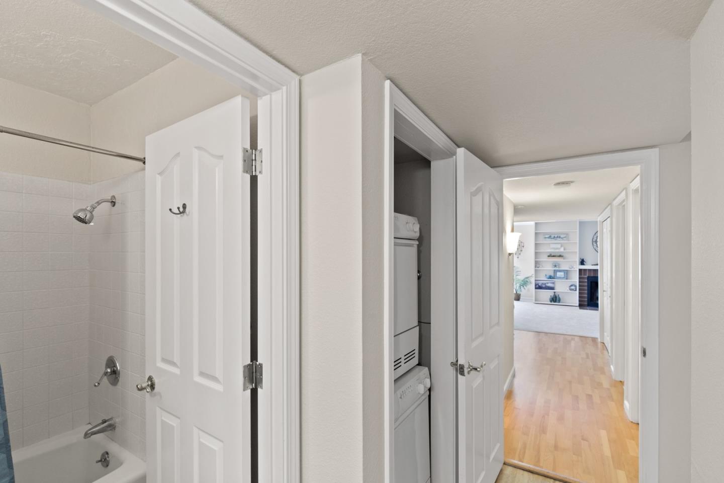 321 Broadway, Unit C2 Santa Cruz, CA 95060 - Photo 17 of 46 a view of a hallway with a livingroom and a dinning room with wooden floor
